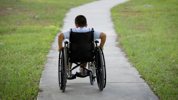 Hispanic boy in wheelchair